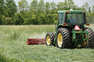 Tractor with roller crimper.