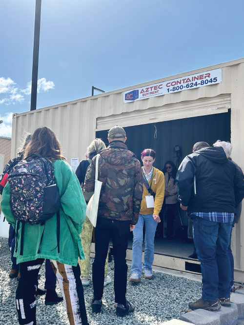 People touring a pesticide storage facility.